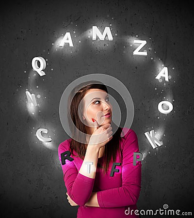 Young woman thinking with letter circulation around her head Stock Photo