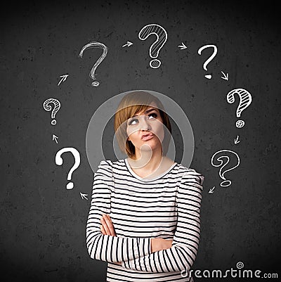 Young woman thinking with question mark circulation around her h Stock Photo