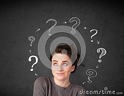 Young woman thinking with question mark circulation around her h Stock Photo