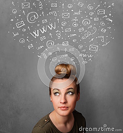 Young woman thinking with social network icons above her head Stock Photo