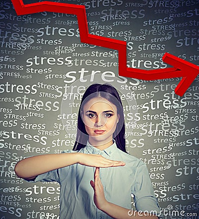 Young woman with time out hand gesture requesting to decrease stress level Stock Photo