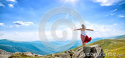 Young woman on the top of mountain Stock Photo