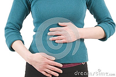 Young woman touching stomach Stock Photo