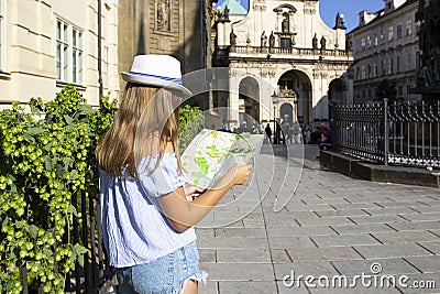 Young woman tourist looking at map, girl visit in old town of Prague, Czech Republic Stock Photo