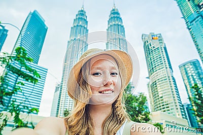 Young woman tourist making selfie on the background of skyscrapers. tourism, travel, people, leisure and technology concept Stock Photo