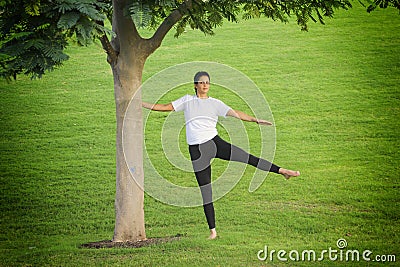 Young woman training in nature Stock Photo