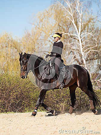 Young woman trains a horse Stock Photo