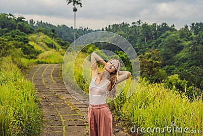 Young woman traveler in Campuhan Ridge Walk , Scenic Green Valley in Ubud Bali Stock Photo