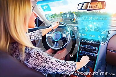 Young woman traveling in self driving car Stock Photo