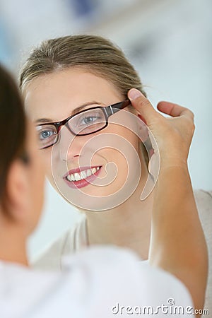 Young woman trying on eyeglasses Stock Photo