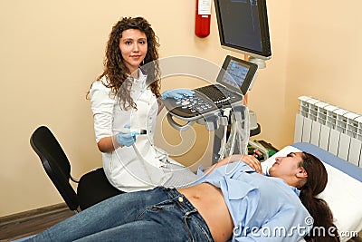 Young woman on the ultrasound, health check with the doctor Stock Photo