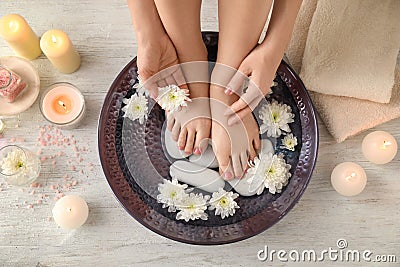 Young woman undergoing spa pedicure treatment in beauty salon Stock Photo