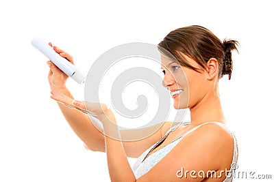 Young woman using body lotion Stock Photo