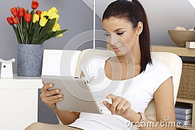 Young woman using tablet pc Stock Photo