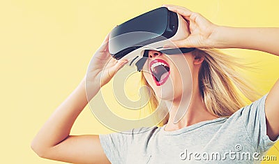 Young woman using a virtual reality headset Stock Photo