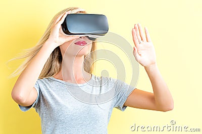 Young woman using a virtual reality headset Stock Photo