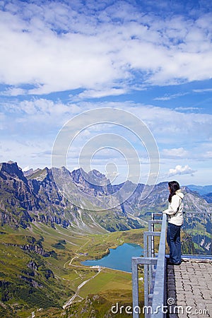 Young woman in a viewpoint of Swiss Alps Stock Photo