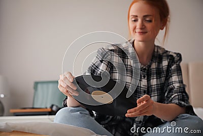 Young woman with vinyl disc for turntable Stock Photo