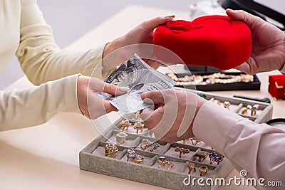 Young woman visiting old male jeweler Stock Photo