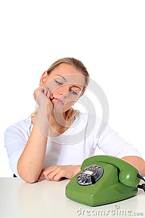 Young woman waiting for phone call Stock Photo