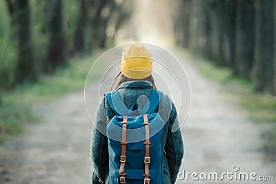 Young woman walking on an avenue on her travel journey Stock Photo