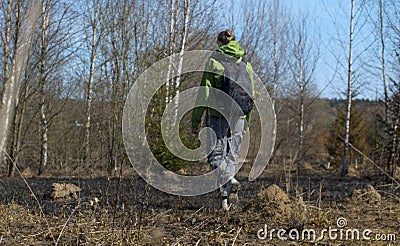 Young woman walking in coppice Stock Photo