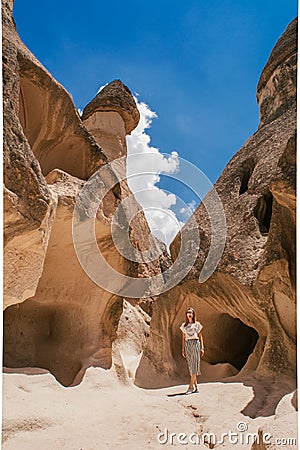 Young woman walking among Pasabag valley in Cappadocia. Stock Photo