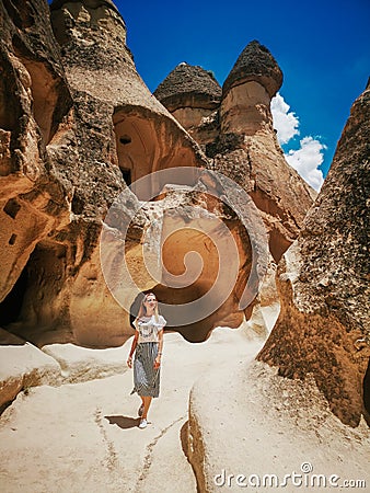 Young woman walking among Pasabag valley in Cappadocia. Stock Photo