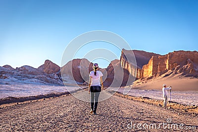 Young woman walking in a surreal landscape in the Moon valley valle de la luna in Atacama Desert, Chile Editorial Stock Photo