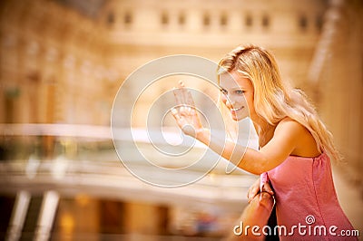 Young woman waves hand Stock Photo