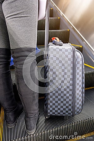 Young woman wear boot lower half with chess luggage standing on Stock Photo