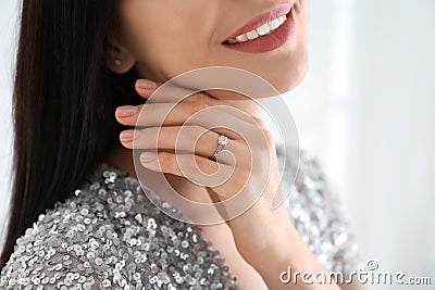 Young woman wearing beautiful engagement ring Stock Photo