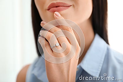 Young woman wearing beautiful engagement ring Stock Photo