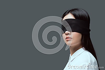 young woman wearing black blindfold Stock Photo