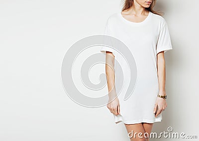 Young woman wearing blank long vest and digital watch. White background Stock Photo