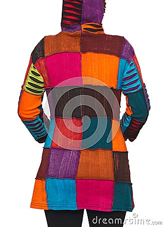 Young woman wearing coat of many colors hooded long patchwork jacket Stock Photo