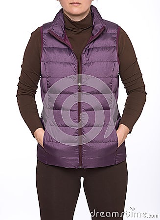Young woman wearing dark plum down vest Stock Photo