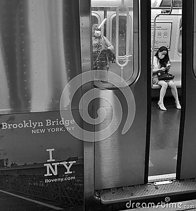 Young Woman Wearing Protective Face Mask on Subway Train New York City Editorial Stock Photo