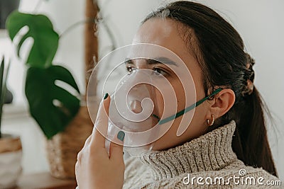 Young woman wearing a respiratory mask to facilitate proper breathing Stock Photo