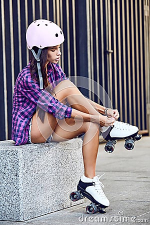 Young woman wearing roller skating shoe outdoors lifestyle portrait Stock Photo