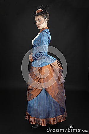 A young woman wearing an 1880s Victorian costume Stock Photo