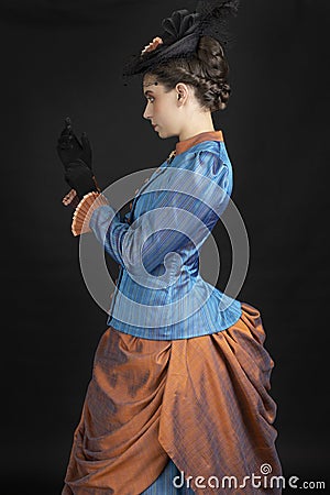 A young woman wearing an 1880s Victorian costume Stock Photo