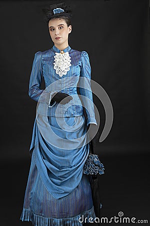 A young woman wearing an 1880s Victorian costume Stock Photo