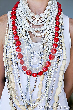 Young woman wearing white beads and one string of hearts Stock Photo