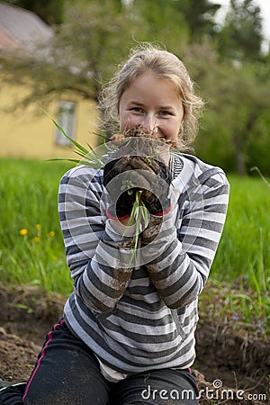 Young woman weeding tillage Stock Photo