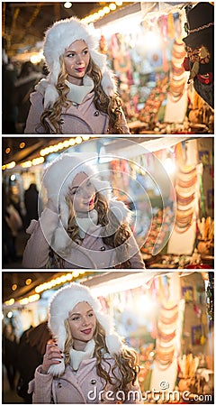 Young woman with white fur cap admiring accessories in Xmas market, cold winter evening. Beautiful blonde girl in winter clothes Stock Photo