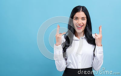 Young woman wishing for good luck Stock Photo