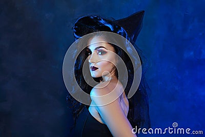 Young woman in witch dress Stock Photo