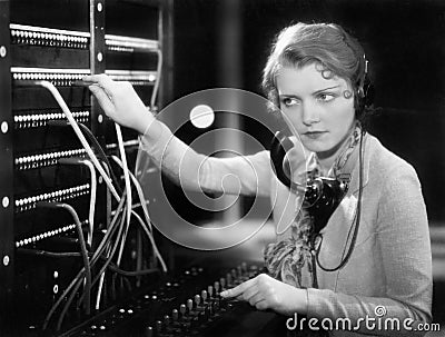 Young woman working as a telephone operator Stock Photo