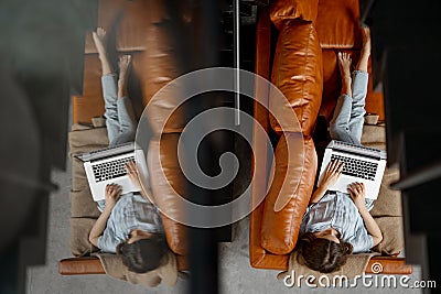 Woman working with laptop from home on sofa Stock Photo